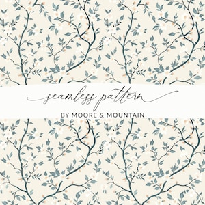 May include: A seamless pattern featuring delicate white flowers and green leaves on a cream background. The text "seamless pattern" and "BY MOORE & MOUNTAIN" is displayed below the floral design.