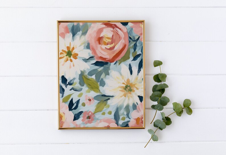 May include: A framed painting featuring a floral design. The painting depicts pink, white and blue flowers on a pale blue background.