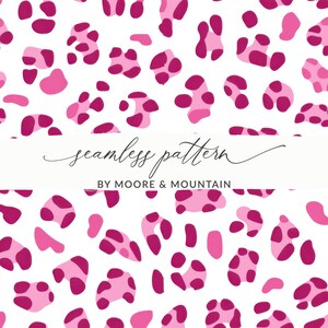 May include: A seamless pattern with pink and magenta abstract shapes on a white backdrop. The design features various sizes and shapes of spots, with the text "seamless pattern" and "BY MOORE & MOUNTAIN" in the image.