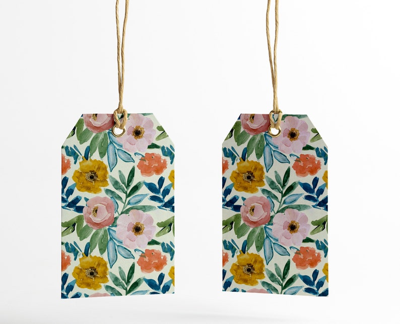 May include: Two floral gift tags with a white background and a watercolor pattern of pink, yellow, and orange flowers with green leaves. The tags are attached to twine.