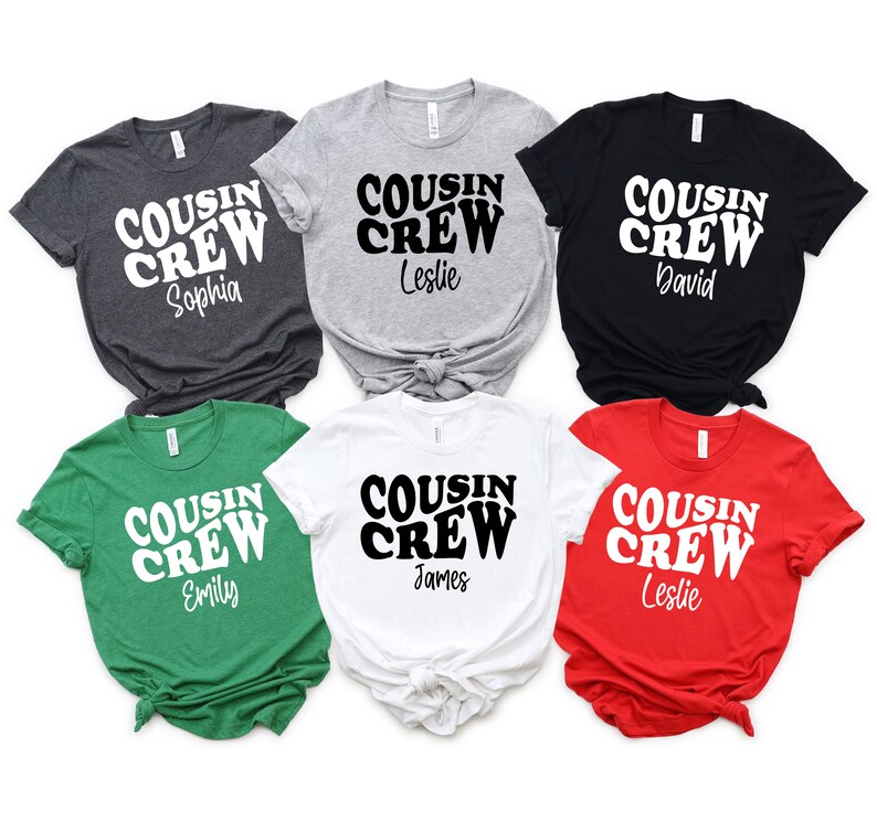 May include: Six t-shirts in different colors with the text "COUSIN CREW" in a retro font and a name underneath. The colors are green, red, white, black, gray, and heather gray.