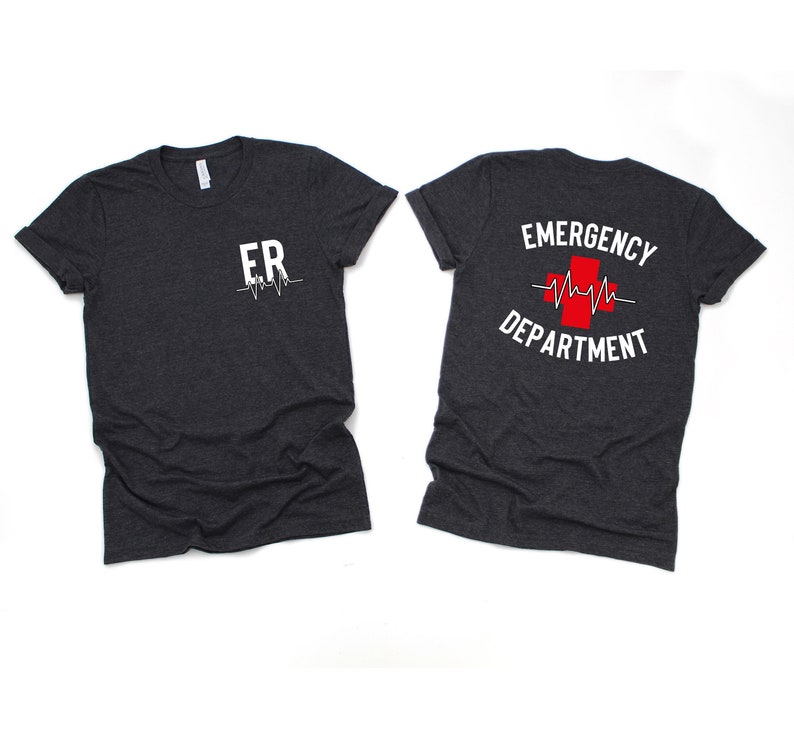 May include: Two dark heather grey t-shirts with a white graphic print. The front shirt says "ER" with a heartbeat symbol. The back shirt says "EMERGENCY DEPARTMENT" with a red cross and a heartbeat symbol.