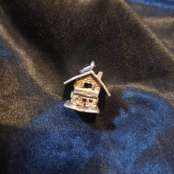 An opening swisd or austrian alpen lodge pendant or charm, 925 sterling silver. Hinged and opens.