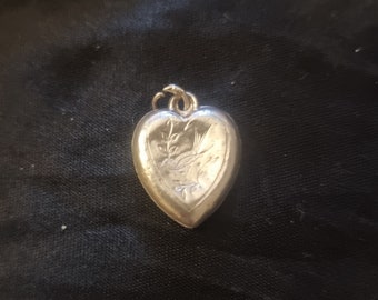 A love heart Charm in 925 sterling silver.