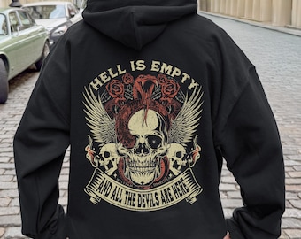 May include: Black hooded sweatshirt with a graphic on the back. The graphic features a skull with a snake, wings, roses, and the text "HELL IS EMPTY AND ALL THE DEVILS ARE HERE".