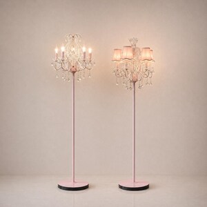 May include: Two pink floor lamps with crystal chandelier-style light fixtures. One lamp has exposed bulbs, while the other has pink lampshades. The lamps have a pink base and stem, and a black, semi-circular base.