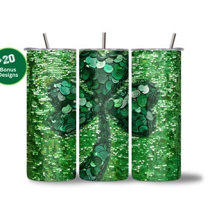 May include: Three green and silver stainless steel tumblers with a shamrock design. The tumblers are covered in green glitter.