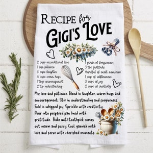 May include: White kitchen towel with a recipe for Gigi's Love. The recipe includes ingredients like unconditional love, patience, laughter, warm hugs, and creativity. The towel features a floral design and a whisk.