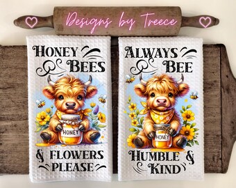 May include: Two white kitchen towels with a cute cartoon Highland cow holding a jar of honey. The first towel says "Honey & Bees & Flowers Please". The second towel says "Always Bee Humble & Kind".