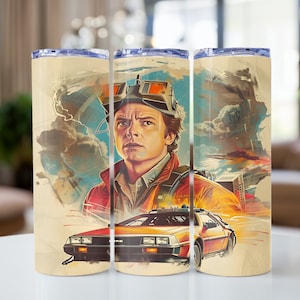 May include: A stainless steel tumbler featuring a retro-style illustration of a character from the film Back to the Future. The illustration shows the character in a futuristic outfit, driving a DeLorean time machine. The background is a colourful depiction of a city skyline and clouds.