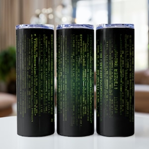 May include: Three black and green stainless steel tumblers with a green matrix code design. The tumblers are on a white surface.