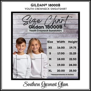 May include: Gildan 18000B youth crewneck sweatshirt size chart featuring two children wearing white sweatshirts. The chart lists sizes XS through XL with corresponding width and height measurements in inches, ranging from 16.00 to 25.50 inches.