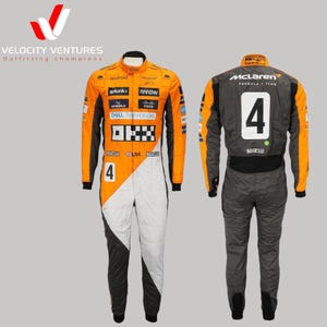 May include: A racing suit in orange, white, and black with the number 4 on the front and back. The suit has several sponsor logos, including "android", "splunk", "Arrow", "Cisco", and "DELL Technologies". The back of the suit has the McLaren Formula 1 Team logo.
