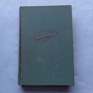 May include: A teal blue hardback book with the words "My Third Edition" written in gold lettering and circled in red ink.