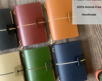 May include: Six different colored leather notebooks with a gold clasp and a string closure. The notebooks are made from cactus and are 100% animal-free. The text on the image reads "Made From Cactus! 100% Animal-Free Handmade".