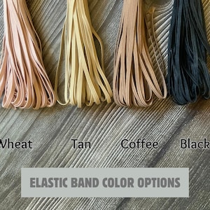 May include: Four spools of elastic band in different colors: wheat, tan, coffee, and black.  Elastic Band Color Options.