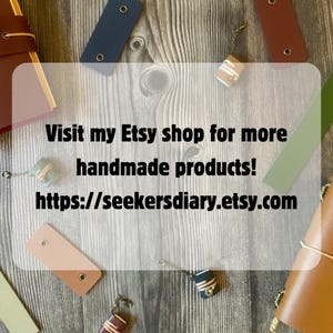 A collage of different handmade products including mini book charms, journal covers, bookmarks, and pen holders.  An overlay of text which reads: Visit my Etsy shop for more handmade products!  https://seekersdiary.etsy.com