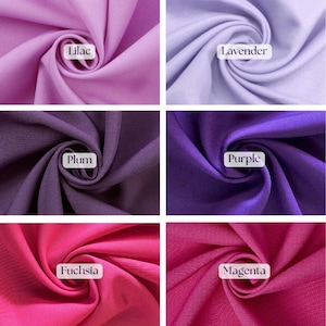 May include: A collection of fabric swatches in various shades of purple and pink. The colors include lilac, lavender, plum, purple, fuchsia, and magenta. Each swatch is labeled with its corresponding color name in a white rectangular box.