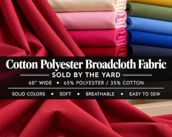 Può includere: Una pila di tessuto in popeline di cotone e poliestere piegato in vari colori solidi, tra cui rosso, bianco, crema, rosa, magenta, giallo, verde oliva e sfumature di blu. Il testo recita: Cotton Polyester Broadcloth Fabric.