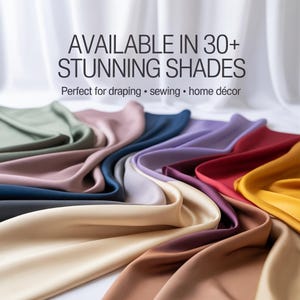 May include: A selection of fabric samples in a range of colours, such as green, pink, blue, purple, red, and yellow. The image features the text "AVAILABLE IN 30+ STUNNING SHADES" and "Perfect for draping • sewing • home décor". The fabric has a smooth, flowing texture.