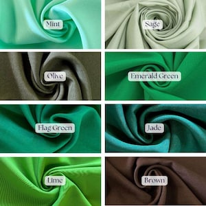 May include: A collection of fabric swatches in various shades of green and brown. The swatches are labeled with names like "Mint," "Sage," "Olive," "Emerald Green," "Flag Green," "Jade," "Lime," and "Brown." The fabric is tightly swirled, showcasing its texture and color.