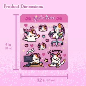 Puede incluir: Un conjunto de 8 pegatinas de tem&aacute;tica de gatos rosa y blanco con un gato jugador con auriculares, una silla de juego, un ordenador y el texto "I &hearts; GAMES". Las pegatinas miden 10 cm de alto y 8,2 cm de ancho.