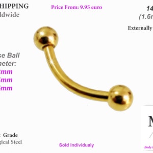 Può includere: Barbell curvo dorato con estremità filettate esternamente. Scegli tra le dimensioni delle sfere di 3 mm, 4 mm o 5 mm. Realizzato in acciaio chirurgico 316L. 14 gauge (1,6 mm).