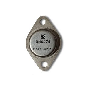 May include: A silver-colored electronic component with a circular center and a diamond-shaped base. The center has the text "SGS 2N5878 ITALY 48414". The component has two holes for mounting.