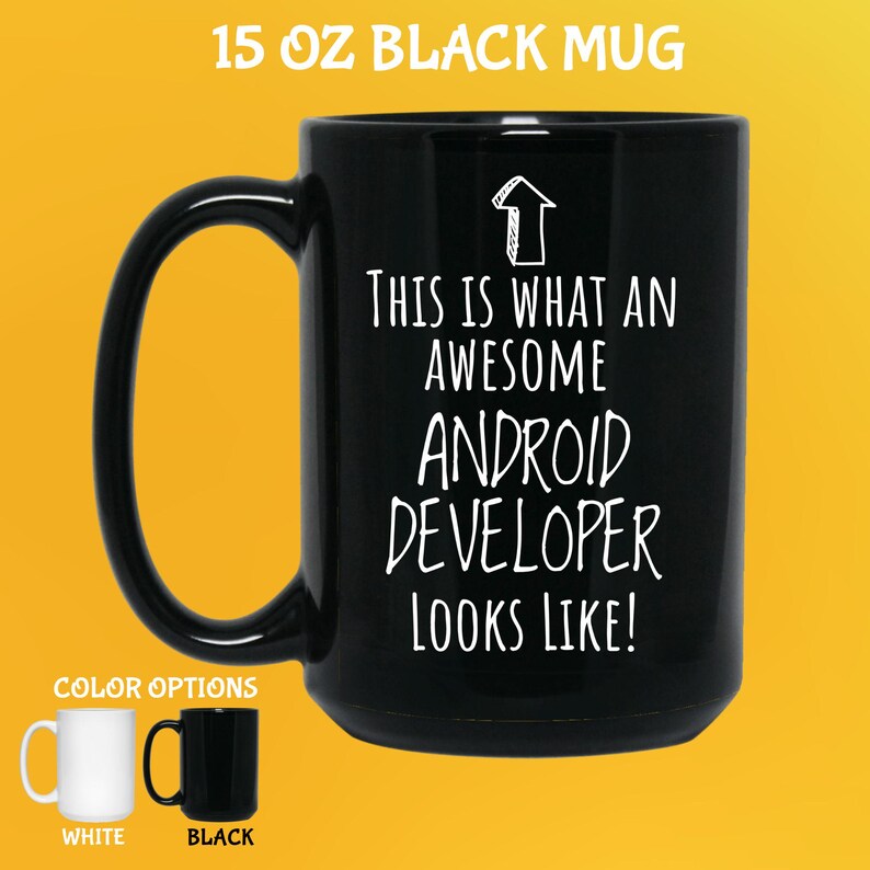 K&ouml;nnte beinhalten: Schwarze 444 ml Tasse mit dem wei&szlig;en Text "THIS IS WHAT AN AWESOME ANDROID DEVELOPER LOOKS LIKE!". Die Tasse hat einen gro&szlig;en Henkel und wird mit wei&szlig;en und schwarzen Farboptionen gezeigt.