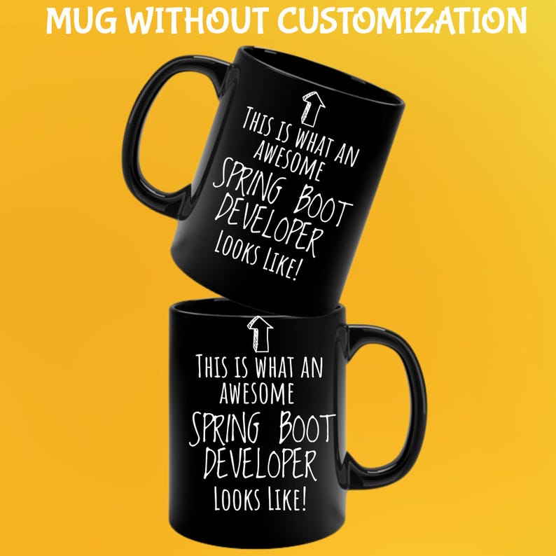 May include: Two black coffee mugs stacked on top of each other. The top mug is angled, displaying the text "THIS IS WHAT AN AWESOME SPRING BOOT DEVELOPER LOOKS LIKE!" in white. The bottom mug has the same text. The background is yellow.