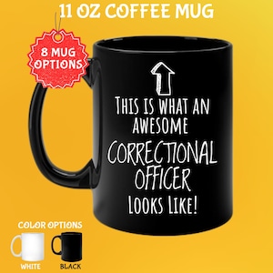 May include: Black 11 oz coffee mug with the text "THIS IS WHAT AN AWESOME CORRECTIONAL OFFICER LOOKS LIKE!" in white. The mug has a black handle and a white arrow graphic. Color options include white and black.