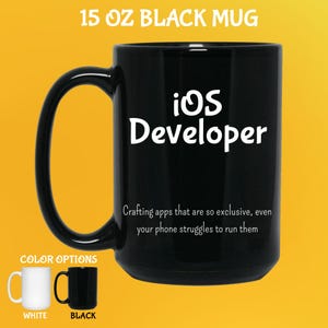 May include: Black 444 ml mug with the text "iOS Developer" in white. The mug also has the text "Crafting apps that are so exclusive, even your phone struggles to run them." Color options are white and black.