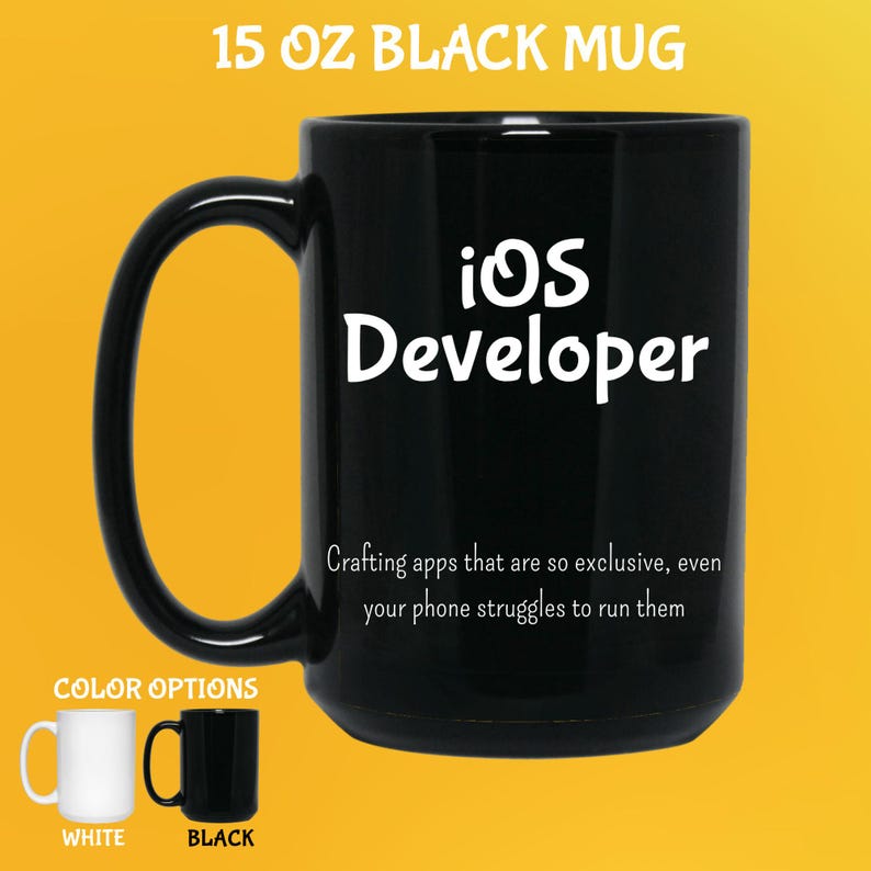 May include: Black 444 ml mug with the text "iOS Developer" in white. The mug also has the text "Crafting apps that are so exclusive, even your phone struggles to run them." Color options are white and black.