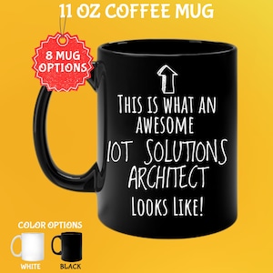 May include: Black 325 ml coffee mug with the text "THIS IS WHAT AN AWESOME IOT SOLUTIONS ARCHITECT LOOKS LIKE!" in white. The mug has a black handle and is labeled with "8 MUG OPTIONS" and "COLOR OPTIONS". Available in white and black.