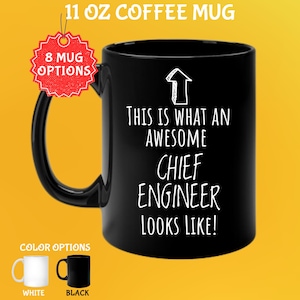 May include: Black 11 oz coffee mug with the text "THIS IS WHAT AN AWESOME CHIEF ENGINEER LOOKS LIKE!" in white. The mug has a black handle and a white arrow graphic. Color options include white and black mugs.