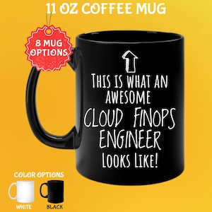 May include: Black 325 ml coffee mug with the text "THIS IS WHAT AN AWESOME CLOUD FINOPS ENGINEER LOOKS LIKE!" in white. The mug has a black handle and is available in white and black. A red tag indicates "8 MUG OPTIONS".