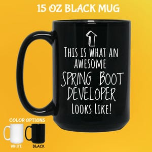 May include: Black 444 ml mug with the text "THIS IS WHAT AN AWESOME SPRING BOOT DEVELOPER LOOKS LIKE!" in white. The mug has a large handle and is shown with white and black colour options.