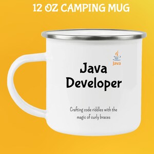 May include: White 355 ml camping mug with a silver rim and handle. The mug features the text "Java Developer" in black, along with the Java logo. Below the text is the phrase "Crafting code riddles with the magic of curly braces."