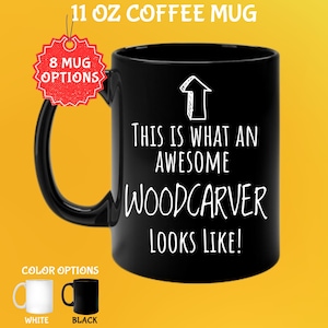 May include: Black 11 oz coffee mug with the text "THIS IS WHAT AN AWESOME WOODCARVER LOOKS LIKE!" in white. The mug has a black handle and an arrow graphic. Color options include white and black mugs.