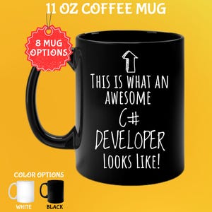 May include: Black 11 oz coffee mug with the text "THIS IS WHAT AN AWESOME C# DEVELOPER LOOKS LIKE!" in white. The mug has a black handle and the image shows color options: white and black. A red tag says "8 MUG OPTIONS".