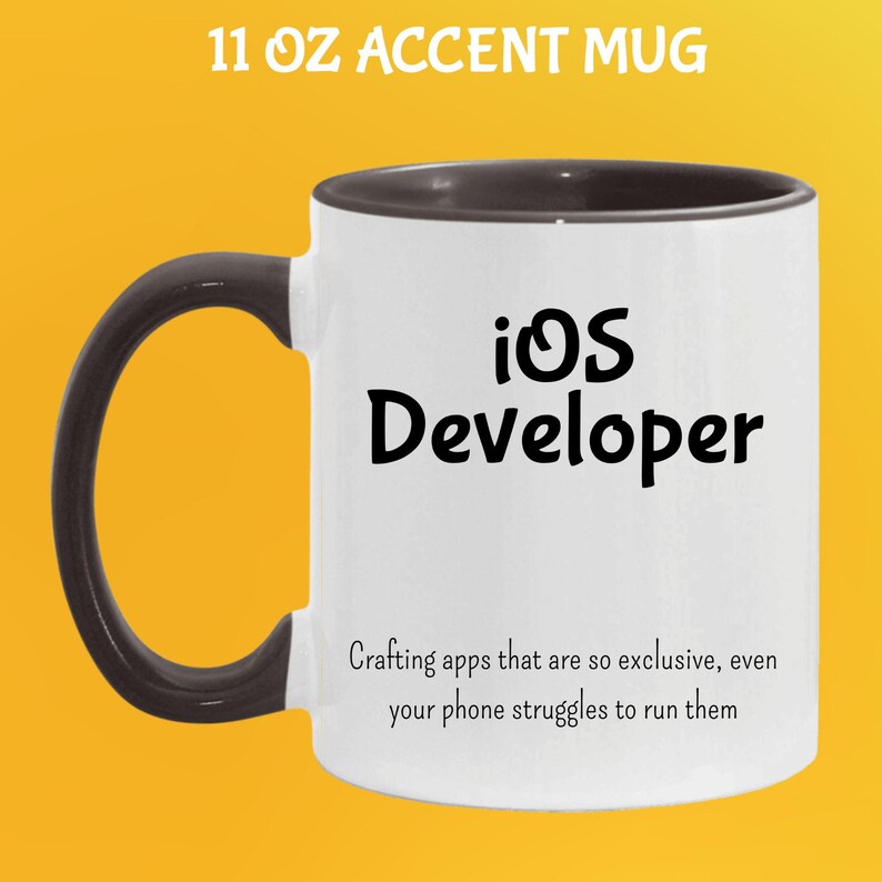 May include: White 11 oz accent mug with a black handle and rim. The mug features the text "iOS Developer" in black, along with a humorous quote about app development. The mug is designed for coffee or tea.