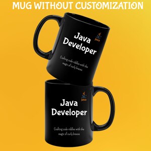 May include: Two black coffee mugs, one on top of the other. The top mug is angled, displaying the text "Java Developer" in white, the Java logo, and the phrase "Crafting code riddles with the magic of curly braces." The bottom mug has the same design.