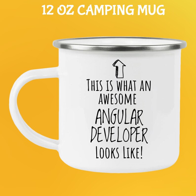 May include: White 12 oz camping mug with a silver rim and handle. The mug features the text "THIS IS WHAT AN AWESOME ANGULAR DEVELOPER LOOKS LIKE!" in black, with an arrow graphic.