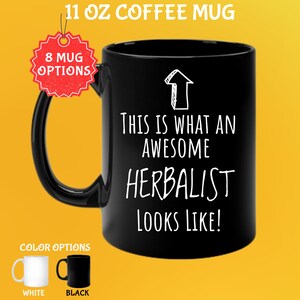May include: Black 11 oz coffee mug with the text "THIS IS WHAT AN AWESOME HERBALIST LOOKS LIKE!" in white. The mug has a black handle and the image shows color options of white and black mugs.