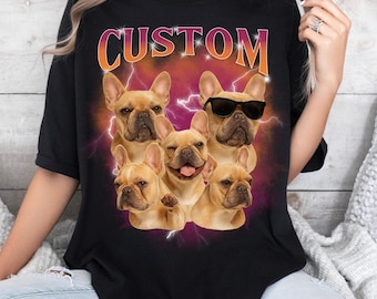 May include: Black t-shirt with a graphic of five French Bulldogs and lightning bolts. The word "CUSTOM" is printed above the dogs in orange and red lettering. One dog is wearing sunglasses.