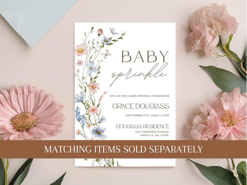 May include: Baby sprinkle invitation with floral accents in pink and blue. The invitation includes the text "Baby Sprinkle", the honoree's name, date, time, and address. The words "Matching items sold separately" are also visible.