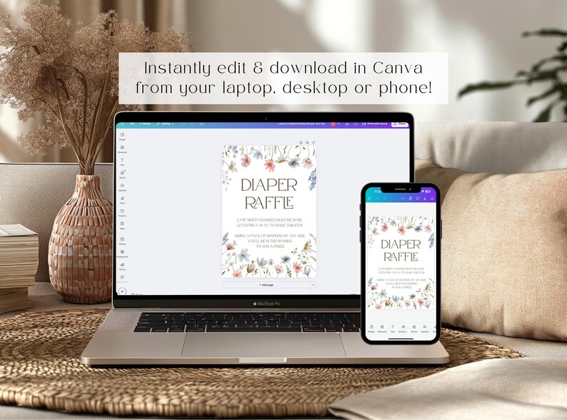 May include: A laptop and a smartphone displaying a printable diaper raffle sign with a floral design. The sign says "Diaper Raffle" and includes text about the raffle. The sign is designed to be edited and downloaded in Canva.