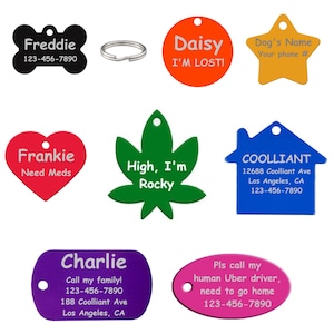 May include: A collection of pet ID tags in various shapes and colors, including a bone, circle, star, heart, leaf, house, and oval. Each tag features a name and contact information, with some including phrases like "I'm Lost!" and "Need Meds."