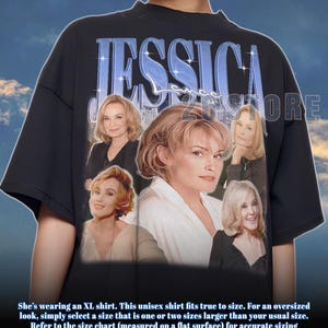 May include: Black unisex t-shirt featuring a collage of images of Jessica Lange, with the name "JESSICA" in blue text. The shirt has a crew neck and short sleeves. The shirt is a unisex fit.