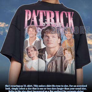 May include: Black unisex t-shirt featuring a collage of Patrick Swayze images with the name "PATRICK" in pink and white lettering. The shirt includes the text "26 STORE".
